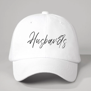 Adjustable white cotton baseball cap featuring black Husbands script embroidery