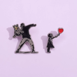 Creative enamel pins featuring Banksy flower thrower and girl with red heart balloon