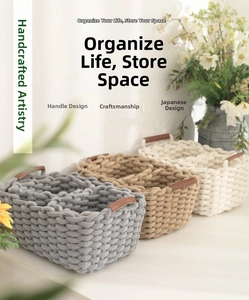 Detailed close-up of woven cotton storage baskets featuring brown leather handles