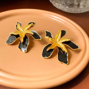 Vintage double layer flower earrings with black enamel petals and matte gold centers