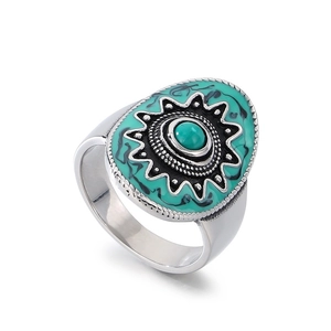Retro Bohemian stainless steel oval ring with starburst pattern and turquoise stone