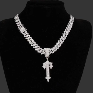 Hiphop silver Cuban chain necklace with iced out cross sword pendant on black mannequin