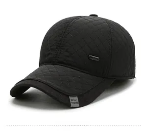 Close-up of diamond quilted windproof winter baseball cap with side metal buckle detail