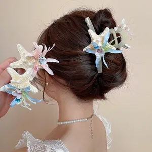 Starfish hair clip set with rhinestones and silk flowers for beach vacation hair styling