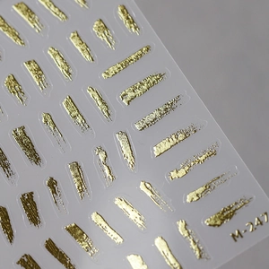 3D gold foil nail art sticker M-247 with irregular metallic texture on clear backing