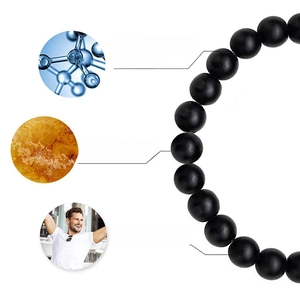 Detailed view of black matte natural stone beads with English function callouts for stress relief