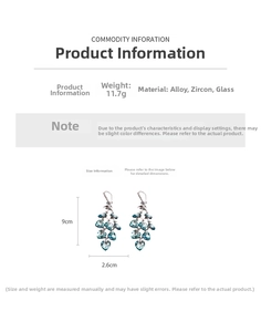 Close-up of heart tassel earrings in silver finish with zircon and blue glass stones