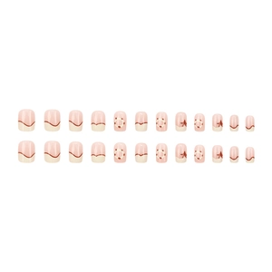 French cream puff style press-on nails with nude pink base and brown wave patterns