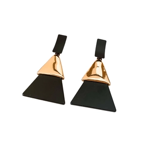 Geometric acrylic triangle earrings with black matte finish and gold metallic accents