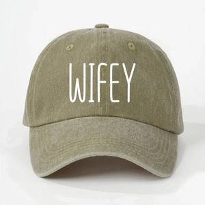 Detail of WIFEY embroidery on olive green washed cotton baseball cap with curved brim
