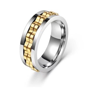 Two-tone silver and gold spinner ring with chain texture on a white background