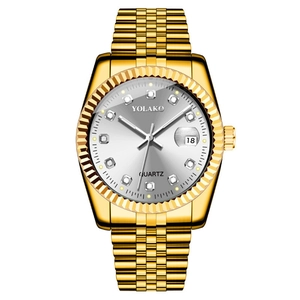 Detailed close-up of gold quartz watch with diamond markers and date window