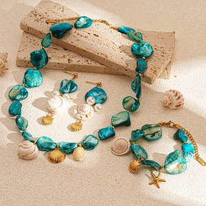Bohemian gold seashell necklace set with starfish and turquoise ocean charms