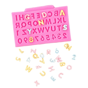 Detailed macro view of pink silicone mold with 3D alphabet and number cavities for DIY baking