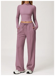 Detail of mauve high-neck compression top and drawstring wide-leg yoga pants set