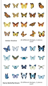 Macro detail of vintage butterfly stickers showing amber and starry sky artistic patterns