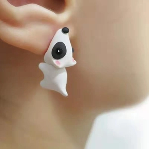 Detailed macro view of 3D panda animal stud earrings with cute pink blush details