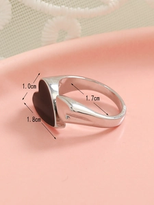 Detail showing ring dimensions with a black enamel heart measuring 1.8cm by 1.0cm