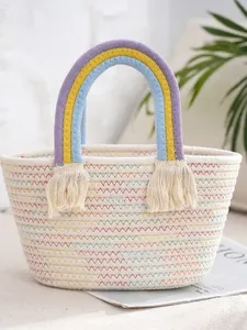 Handmade rainbow woven tote bag with colorful cotton rope texture and white fringe tassels