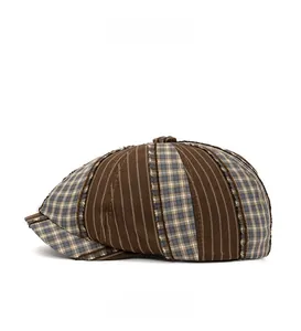 Side view of retro newsboy hat featuring dark brown stripes and blue-gray plaid patchwork