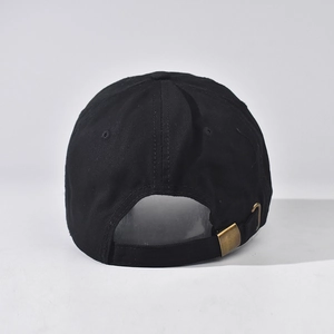 Detail view of washed cotton baseball cap featuring vintage gold metal adjustment buckle