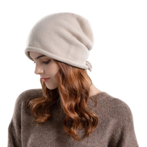 Beige knitted slouchy beanie for women featuring a drawstring and soft cashmere texture