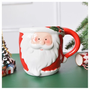 Macro detail of hand-painted ceramic Santa Claus mug with embossed texture and glossy finish