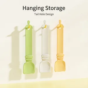 Three-piece long-handled cat treat squeeze spoons in macaron colors hanging on hooks