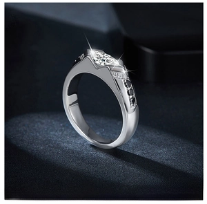 Macro view of marquise-cut moissanite silver ring with black and white diamond accents