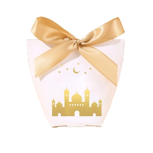 Detail of white gift box with gold ribbon and golden mosque patterns for Eid or weddings