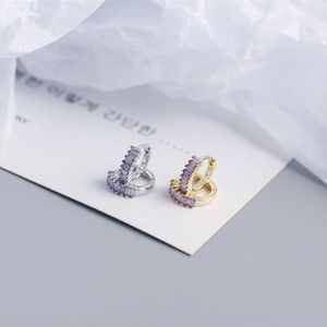 Detail shot of purple rectangular zircon stones set in S925 sterling silver earrings