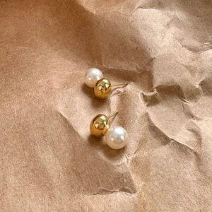 Minimalist 925 sterling silver pearl stud earrings with gold metal ball on craft paper