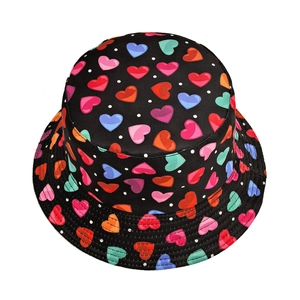 Women's black bucket hat with colorful heart patterns and white polka dots for sun protection