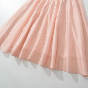 Pink sleeveless maxi dress with a fitted waist and decorative buttons in soft fabric