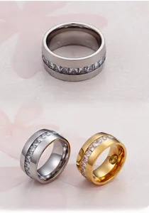 Macro shot of silver and gold plated eternity rings featuring square cut cubic zirconia stones