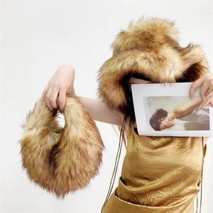 Close-up of fluffy long faux fur texture on brown Y2K style handbag and bucket hat set
