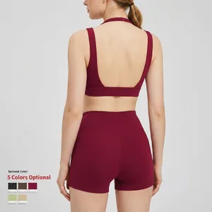 Set yoga da donna con reggiseno sportivo incrociato e pantaloncini a vita alta bordeaux