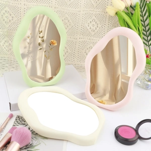Aesthetic cloud-shaped desktop makeup mirrors in pastel green pink and beige wavy frames