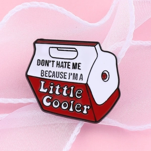 Detail shot of cooler-shaped enamel pin with text Don't Hate Me Because I'm A Little Cooler
