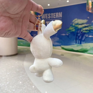 Cute astronaut bunny plush keychain with white fur and golden inner ears on a gold chain