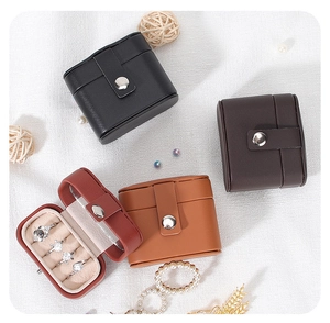 Detailed overhead view of portable PU leather jewelry boxes in four elegant colors