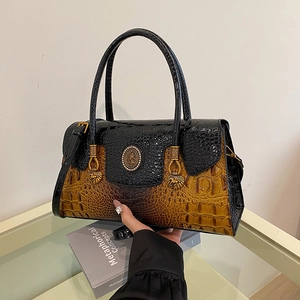 Black and caramel gradient crocodile pattern handbag with gold hardware and lion accents