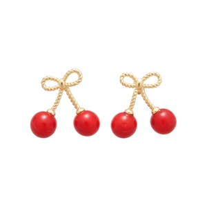 Elegant cherry stud earrings with red resin charms and golden bow hooks on white background