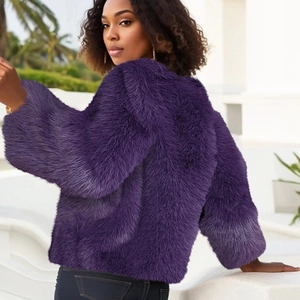 Chic purple faux fur short jacket with a round neck shown in a bright outdoor architectural setting