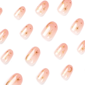 Pink gradient press-on nails with gold star and moon patterns in a short round shape