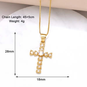 Macro detail of gold cross pendant with clear zircon and precise size measurements