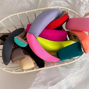 Colorful fabric sponge hair clips in various bright colors on white background