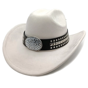 Detail of white suede cowboy hat with studded leather band and rhinestone buckle