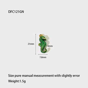 Detail view of green enamel seahorse pendant with dimensions 21mm by 7.8mm