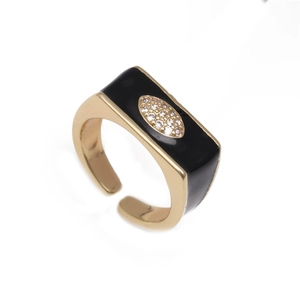 Adjustable gold evil eye ring with black enamel and micro-pave crystals on white background